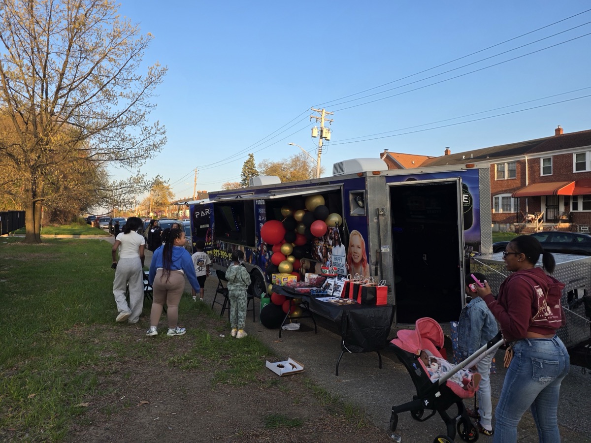 Party Game Truck at neighborhood birthday party with balloons