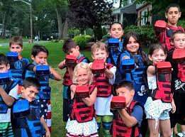 Kids playing laser tag at party
