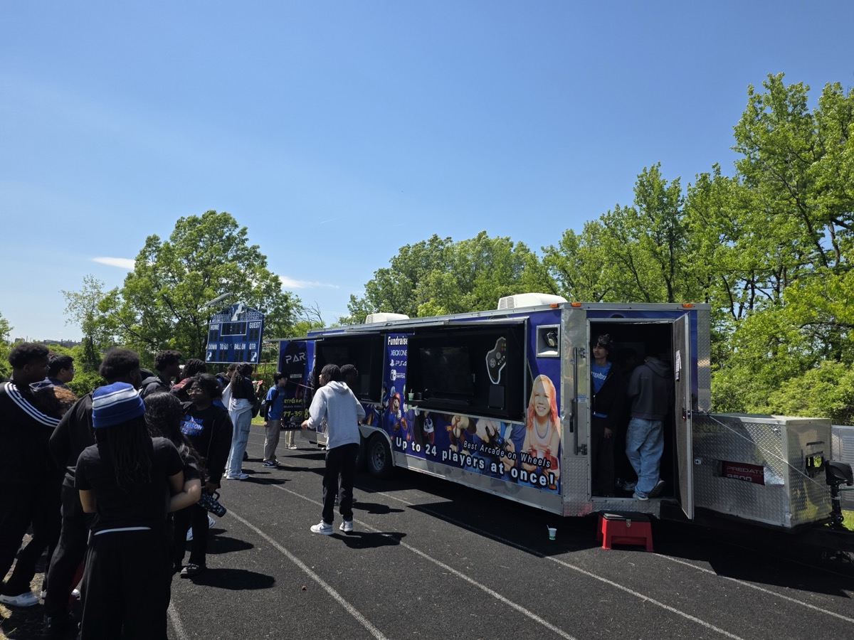 Party Game Truck at school event — kids lined up and excited