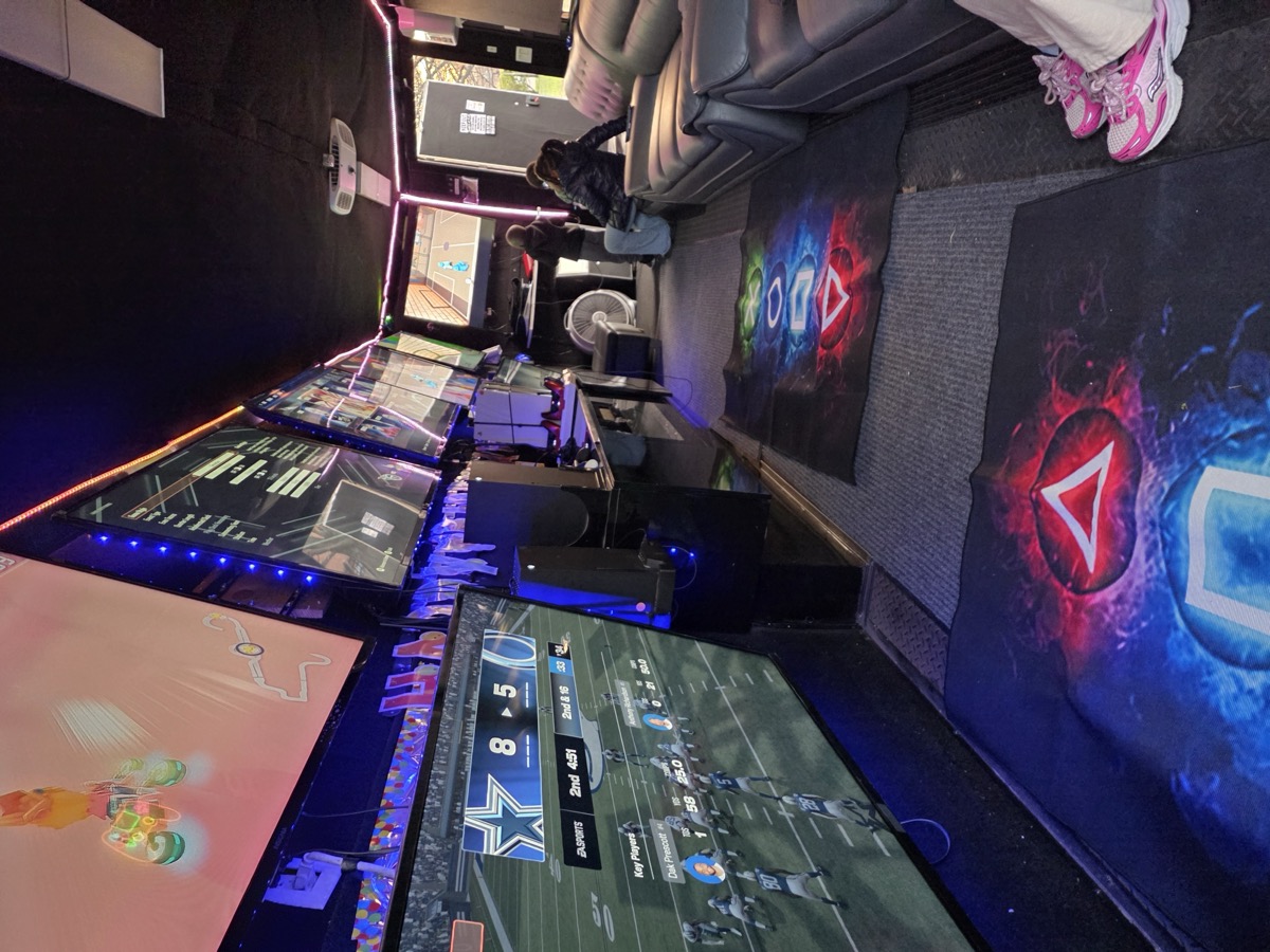 Inside Party Game Truck — LED gaming screens lit up
